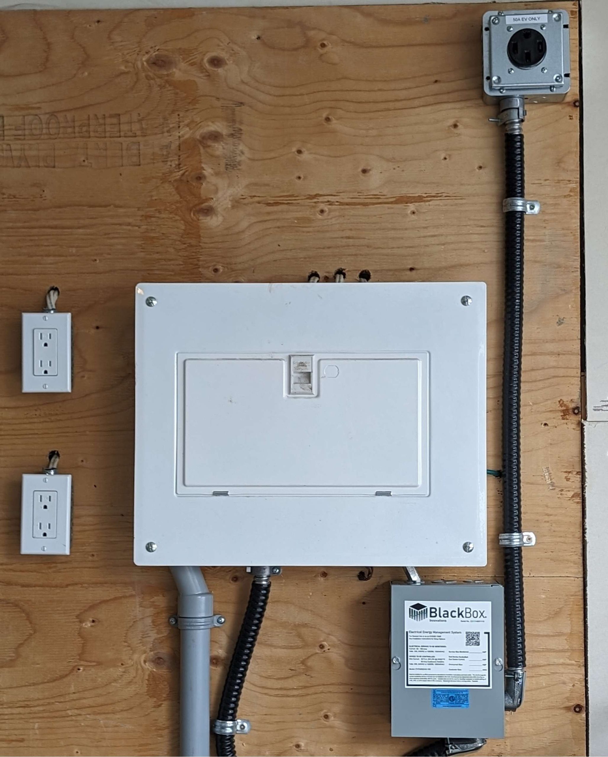 100 Amp Panel with EVEMS and NEMA 14-50 Receptacle for BMW EV in Calgary